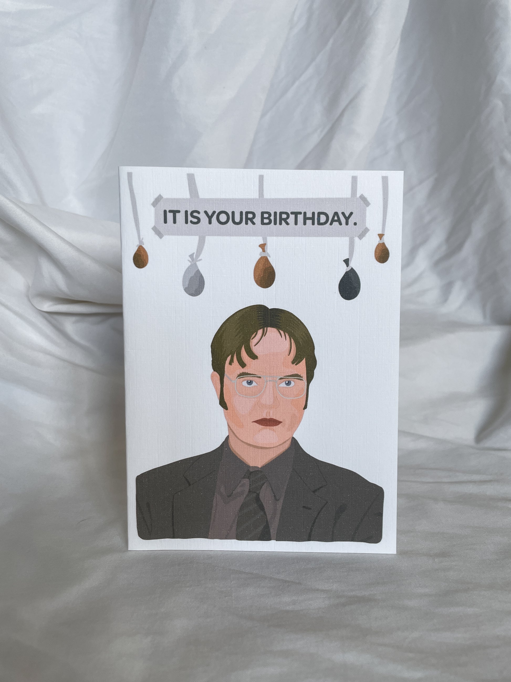 Give the gift of laughter with our Dwight Schrute birthday card, inspired by the iconic character from The Office! Featuring a hilarious illustration of Dwight in all his beet-farming, assistant regional manager glory